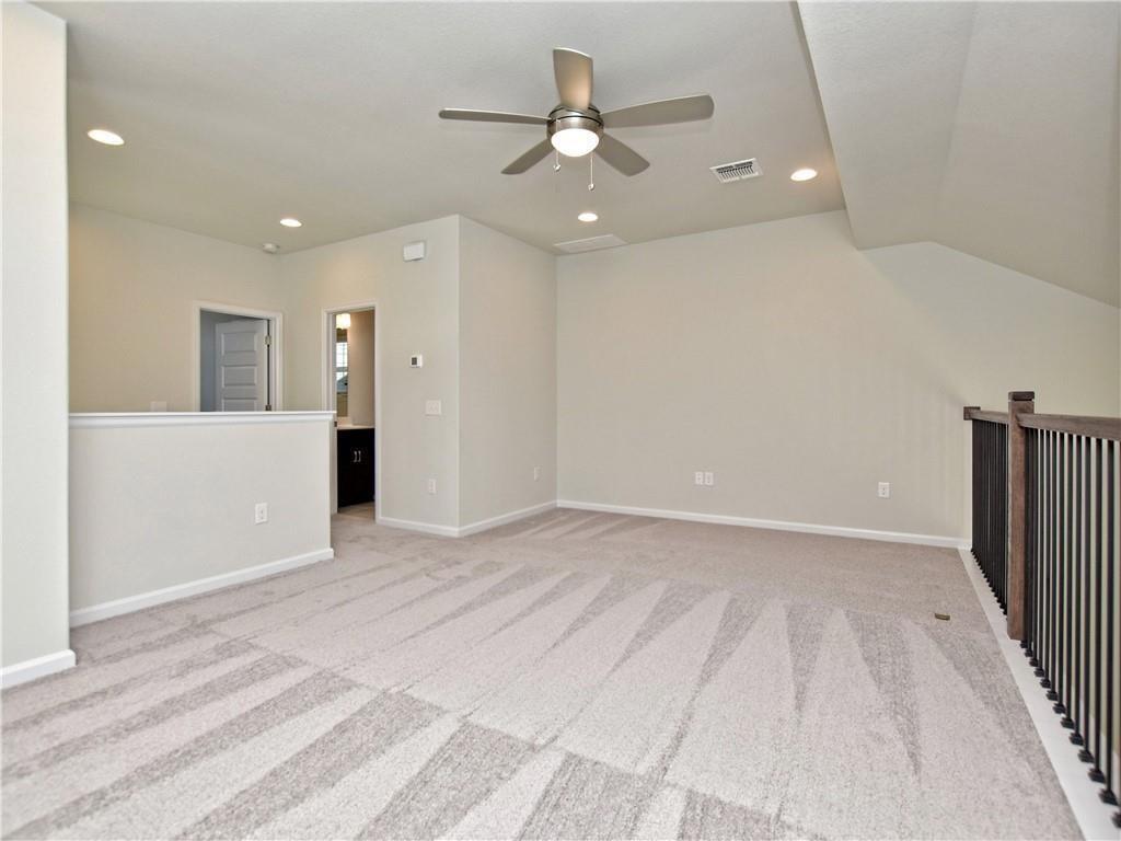 13611 Terrett Trace, Unit 108 Austin, TX 78717 - Photo 24 of 33 a view of an empty room with a ceiling fan