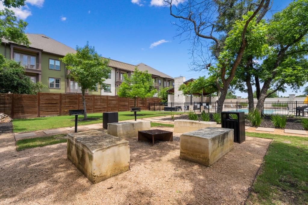 13611 Terrett Trace, Unit 108 Austin, TX 78717 - Photo 30 of 33 a view of a patio with couches and a fire pit
