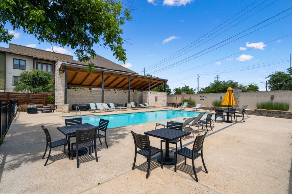 13611 Terrett Trace, Unit 108 Austin, TX 78717 - Photo 32 of 33 a view of patio with chairs and tables