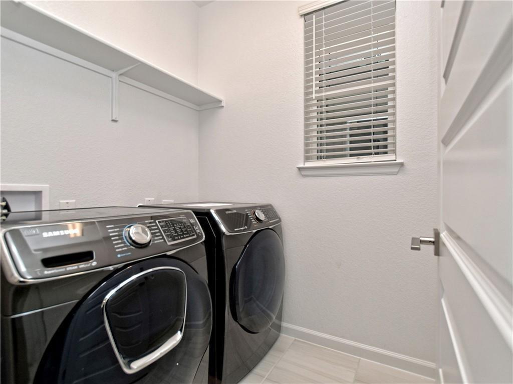 13611 Terrett Trace, Unit 108 Austin, TX 78717 - Photo 10 of 33 a utility room with dryer and washer