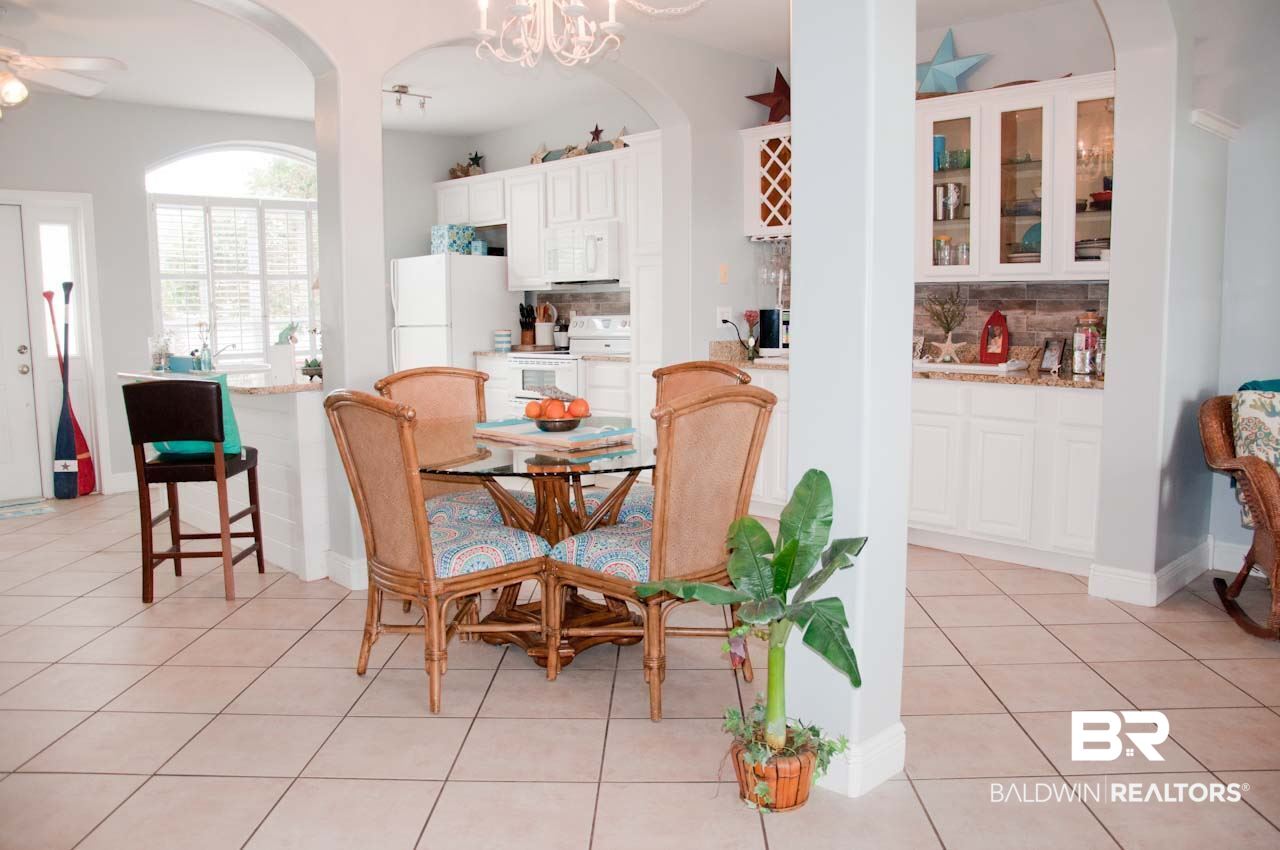 27152 Marina Road, Unit B Orange Beach, AL 36561 - Photo 12 of 37 Spacious living area with French Doors to Water