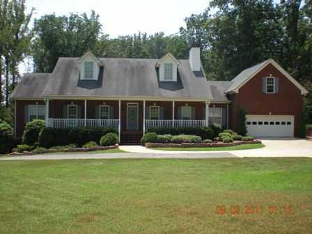 655 Auburn Road Dacula, GA 30019 - Photo 1 of 1 Exterior Front. THIS HOME HAS A LONG RELAXING PORCH PERFECT FOR WATHCING THE SUNSET