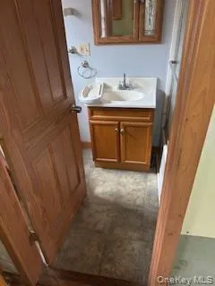 a bathroom with a sink and mirror