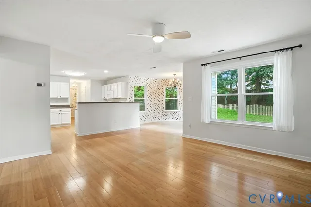 a view of kitchen with wooden floor and windows