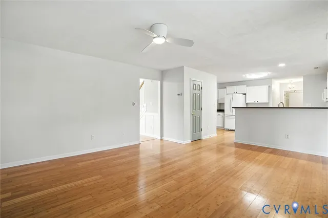 a view of a kitchen with a sink and a refrigerator