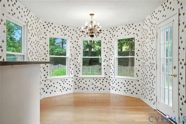 a bathroom with a bathtub and window