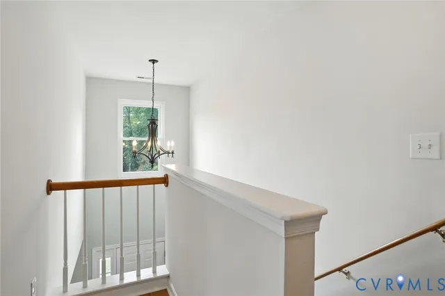 a view of a hallway with windows