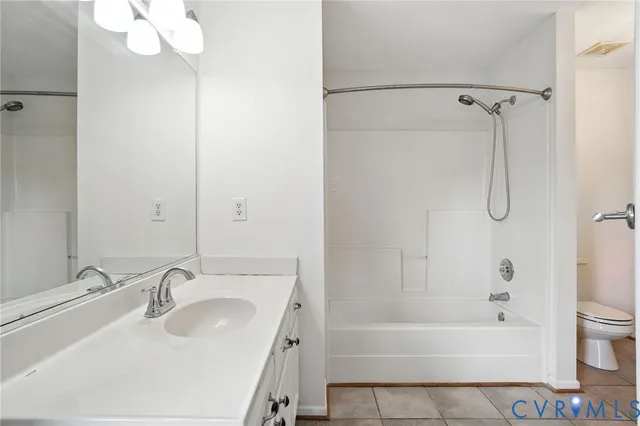 a bathroom with a sink a mirror and a bathtub