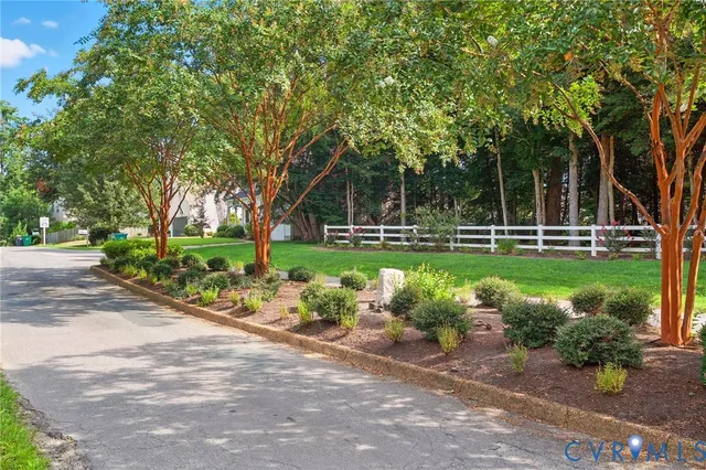 a view of a bench in a park