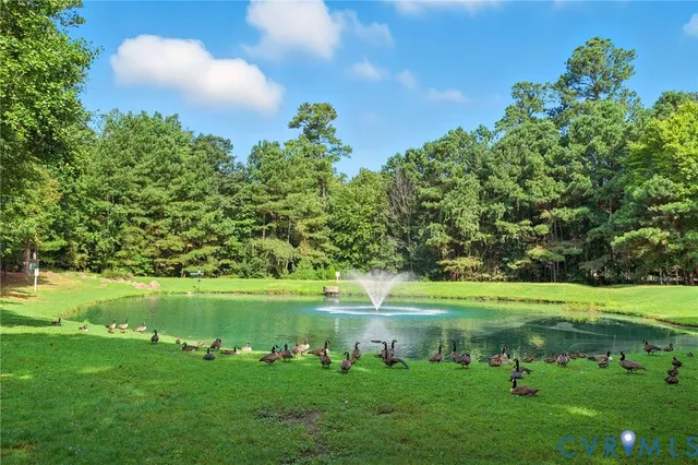 a view of a golf course with a lake view