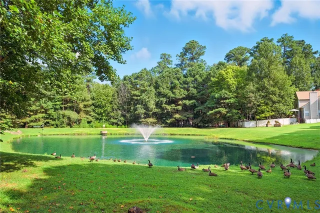 a view of a golf course with a lake