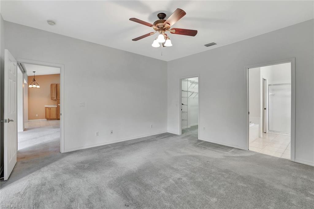 3617 Recreation Lane Naples, FL 34116 - Photo 14 of 25 a view of an empty room with a ceiling fan