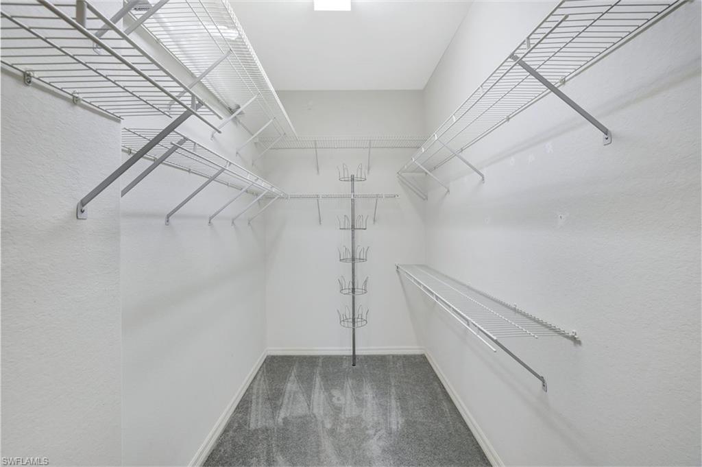 3617 Recreation Lane Naples, FL 34116 - Photo 15 of 25 a view of a room with racks on the wall