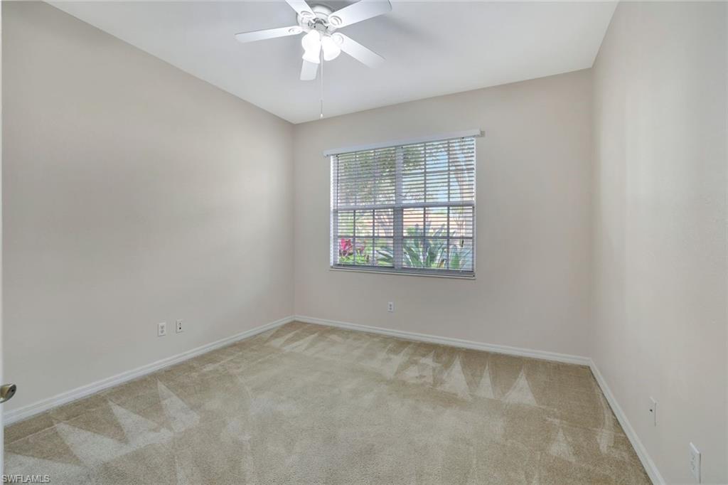 3617 Recreation Lane Naples, FL 34116 - Photo 18 of 25 an empty room with windows
