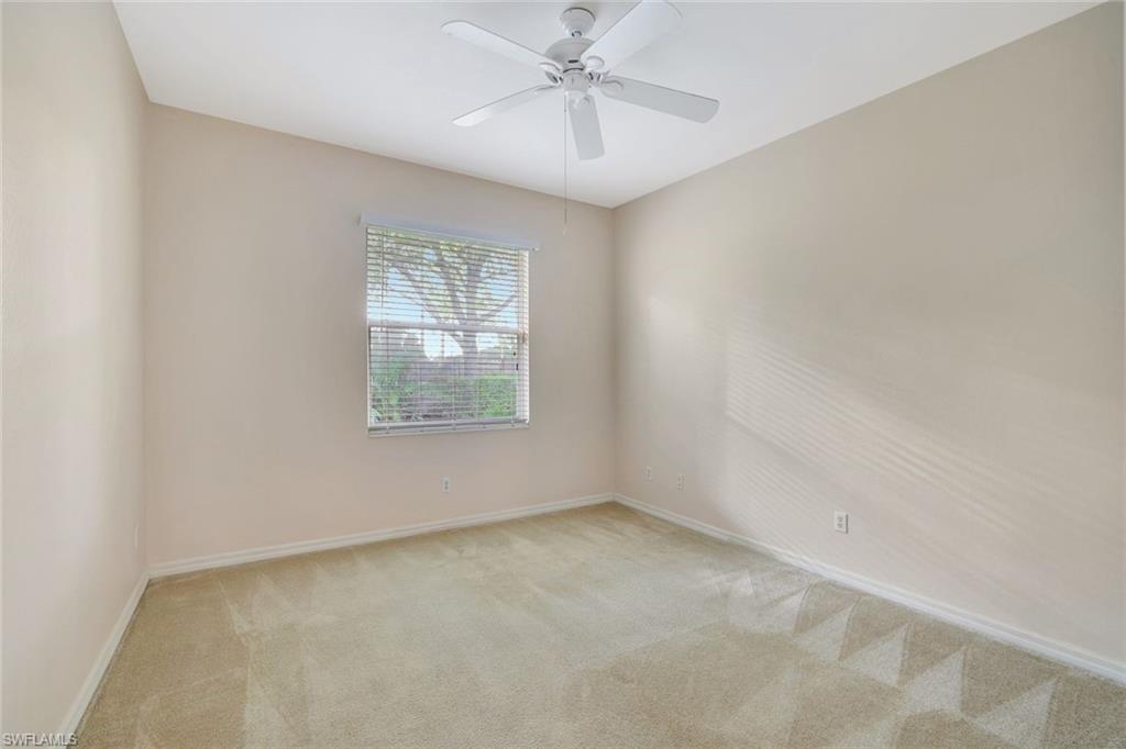 3617 Recreation Lane Naples, FL 34116 - Photo 20 of 25 an empty room with a window and ceiling fan