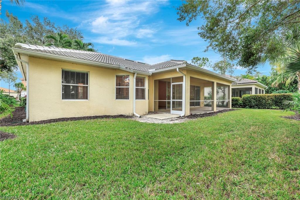 3617 Recreation Lane Naples, FL 34116 - Photo 24 of 25 front view of a house with a yard