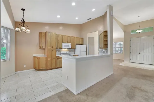 a kitchen with stainless steel appliances granite countertop a stove and a sink