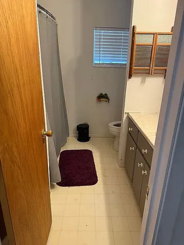 a bathroom with a sink and toilet