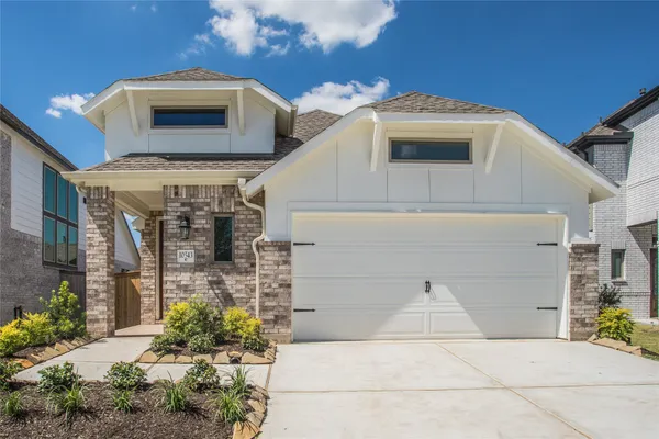 a front view of a house with a garage