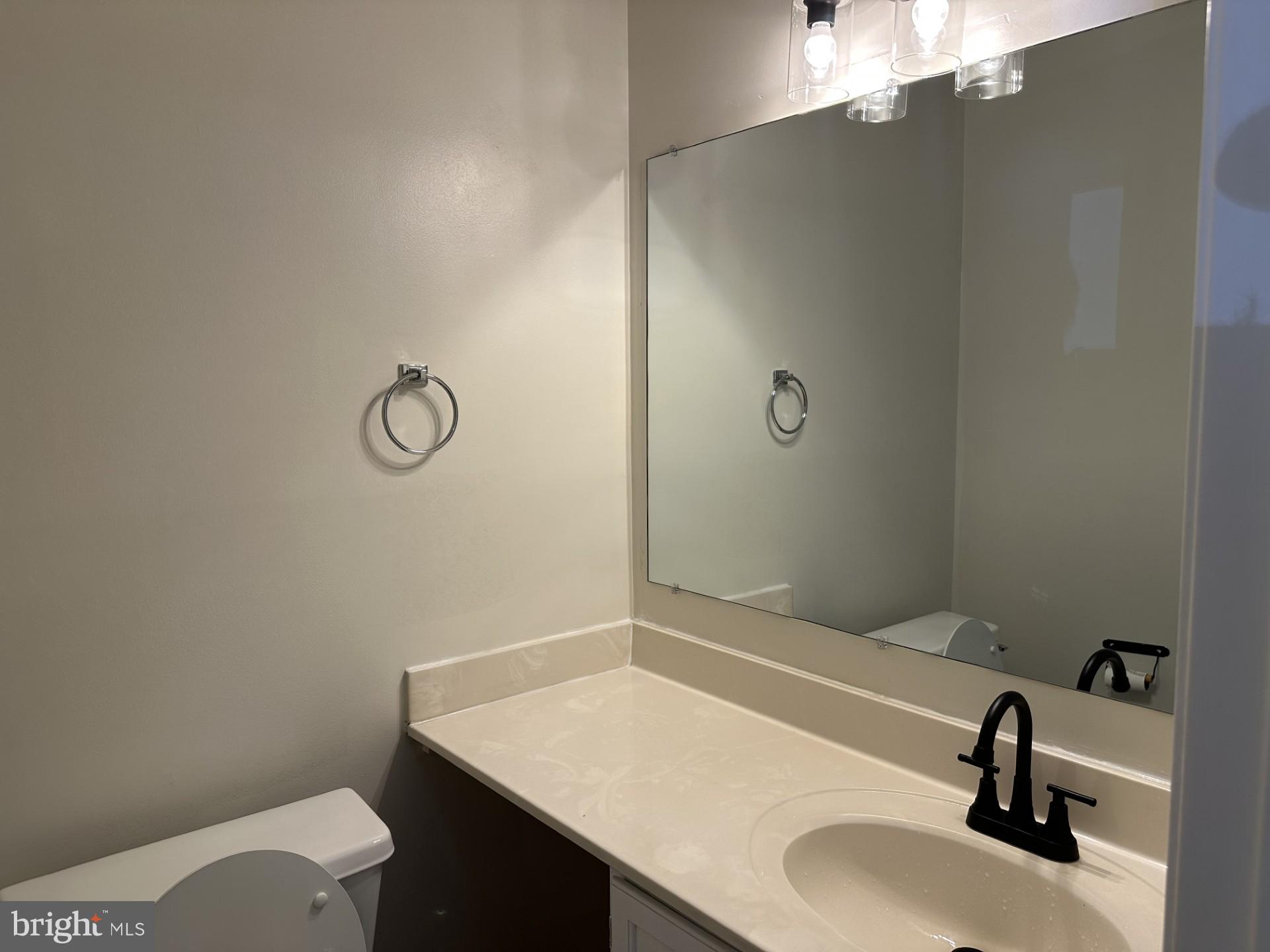 7859 Apache Ridge Court Manassas, VA 20109 - Photo 12 of 27 a bathroom with a sink toilet and vanity
