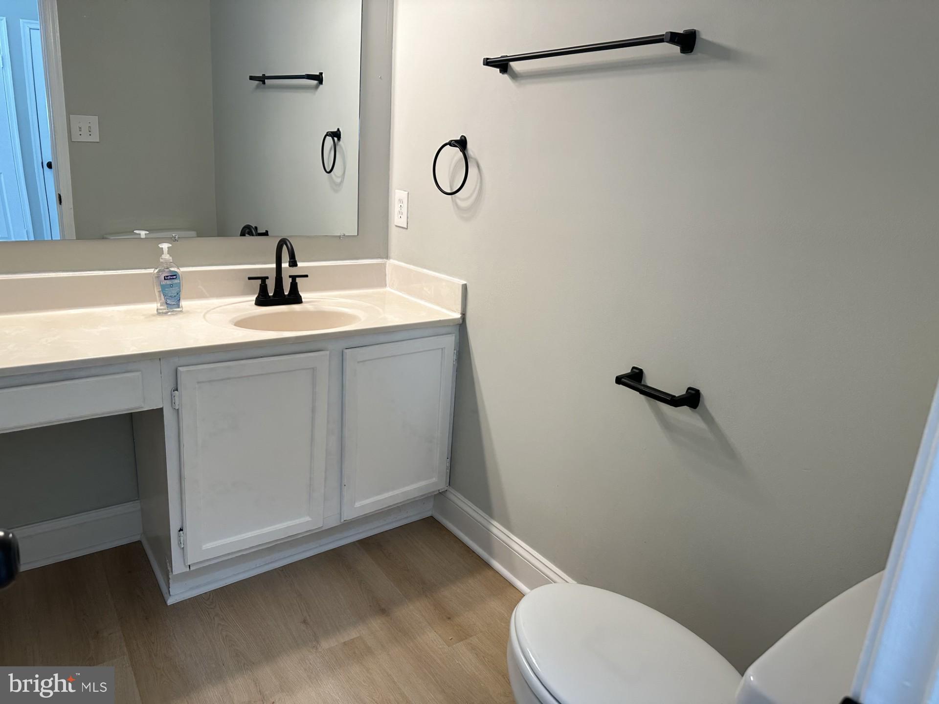 7859 Apache Ridge Court Manassas, VA 20109 - Photo 22 of 27 a bathroom with a toilet sink and mirror