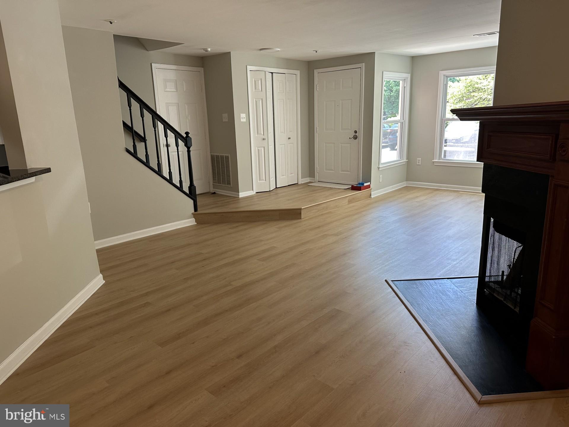 7859 Apache Ridge Court Manassas, VA 20109 - Photo 3 of 27 a view of a livingroom with wooden floor and staircase