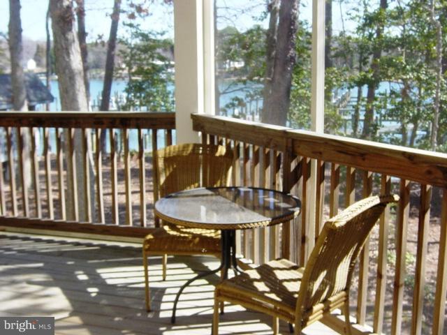 702 Runabout Loop, Unit V10 Solomons, MD 20688 - Photo 1 of 30 a view of a balcony with chairs