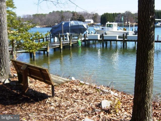 702 Runabout Loop, Unit V10 Solomons, MD 20688 - Photo 11 of 30 a view of a lake with houses