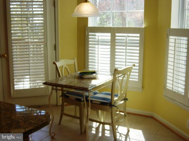 702 Runabout Loop, Unit V10 Solomons, MD 20688 - Photo 16 of 30 a view of a room with a table and chairs