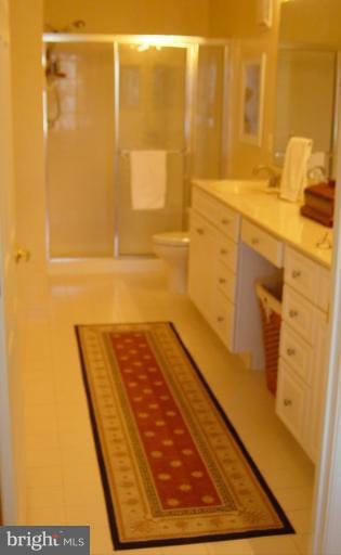 702 Runabout Loop, Unit V10 Solomons, MD 20688 - Photo 17 of 30 a bathroom with a sink and a shower