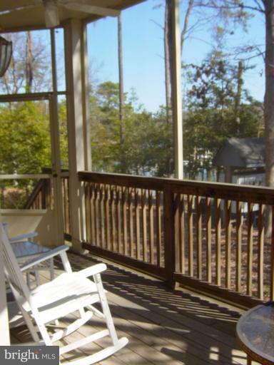 702 Runabout Loop, Unit V10 Solomons, MD 20688 - Photo 19 of 30 a view of a balcony with wooden floor