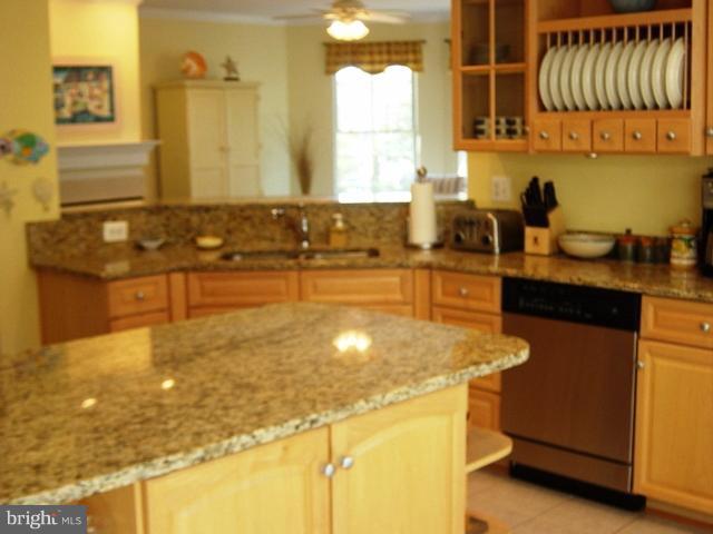 702 Runabout Loop, Unit V10 Solomons, MD 20688 - Photo 3 of 30 a bathroom with a sink a mirror and shower