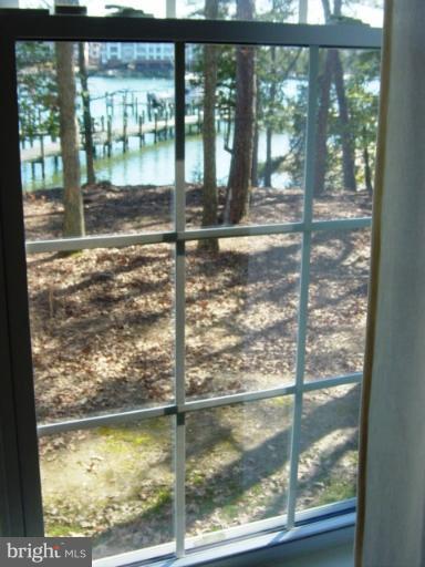 702 Runabout Loop, Unit V10 Solomons, MD 20688 - Photo 4 of 30 a view of a glass door with a yard from a balcony