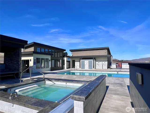 a view of house with outdoor space and sitting area