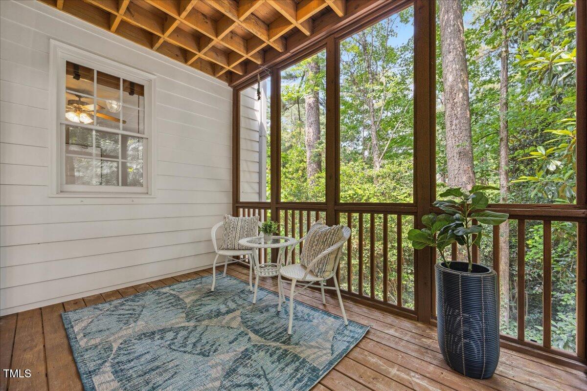 2725 Rosedale Avenue Raleigh, NC 27607 - Photo 27 of 66 Screened porch on main floor with spiral staircase down to backyard.