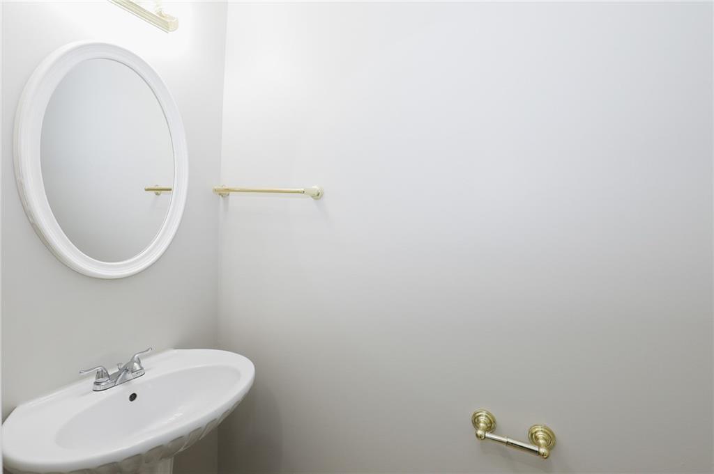 5896 Strathmoor Manor Circle Lithonia, GA 30058 - Photo 14 of 19 a bathroom with a sink and a mirror