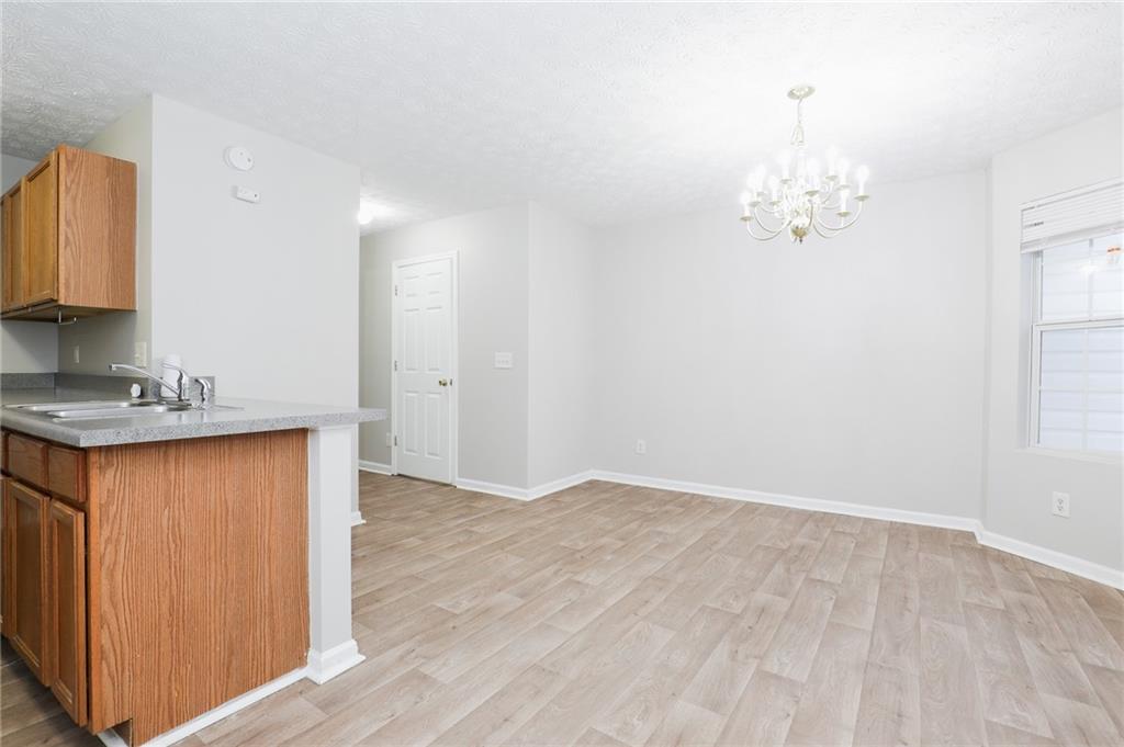 5896 Strathmoor Manor Circle Lithonia, GA 30058 - Photo 5 of 19 a bathroom with a sink vanity and a mirror