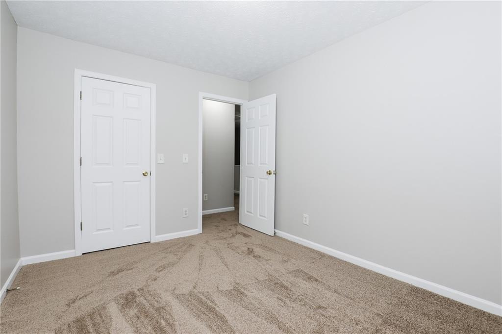 5896 Strathmoor Manor Circle Lithonia, GA 30058 - Photo 9 of 19 a view of an empty room