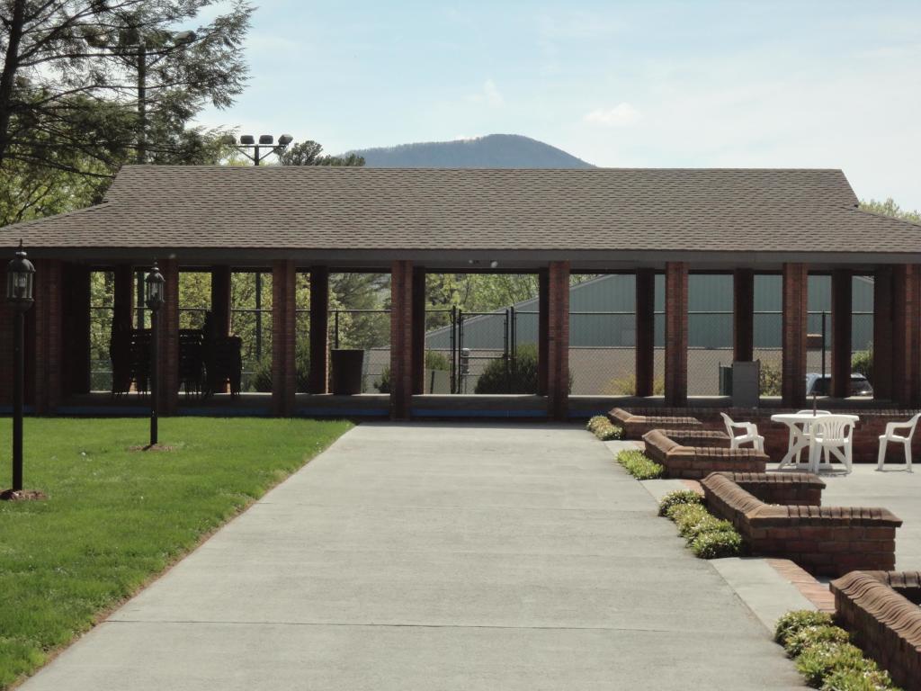 5590 Hunt Camp Road Roanoke, VA 24018 - Photo 10 of 15 a view of a house with backyard porch and sitting area