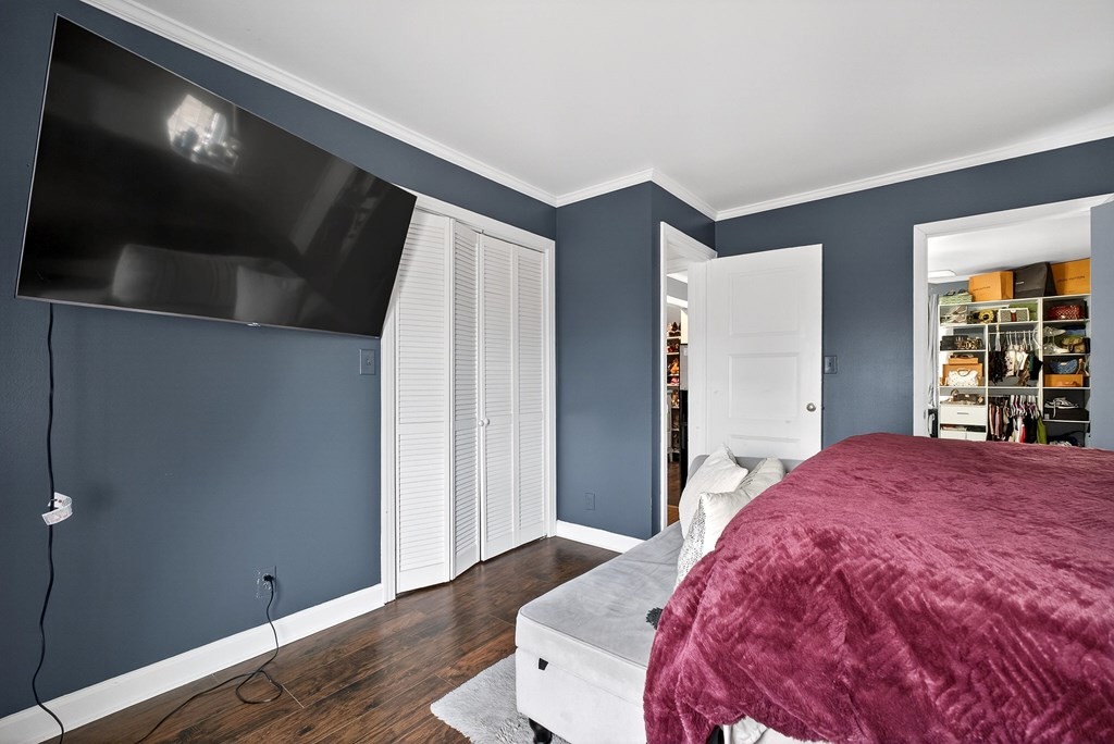 407 Whaley Street Smithville, TN 37166 - Photo 22 of 41 a bedroom with a bed and a flat screen tv