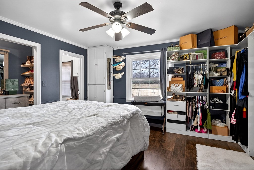 407 Whaley Street Smithville, TN 37166 - Photo 23 of 41 a bedroom with a bed a dresser and book shelf