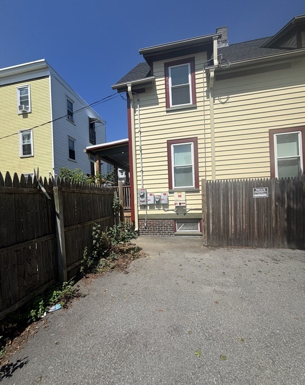 13 Moulton Street Lynn, MA 01905 - Photo 2 of 18 a view of a house with wooden fence