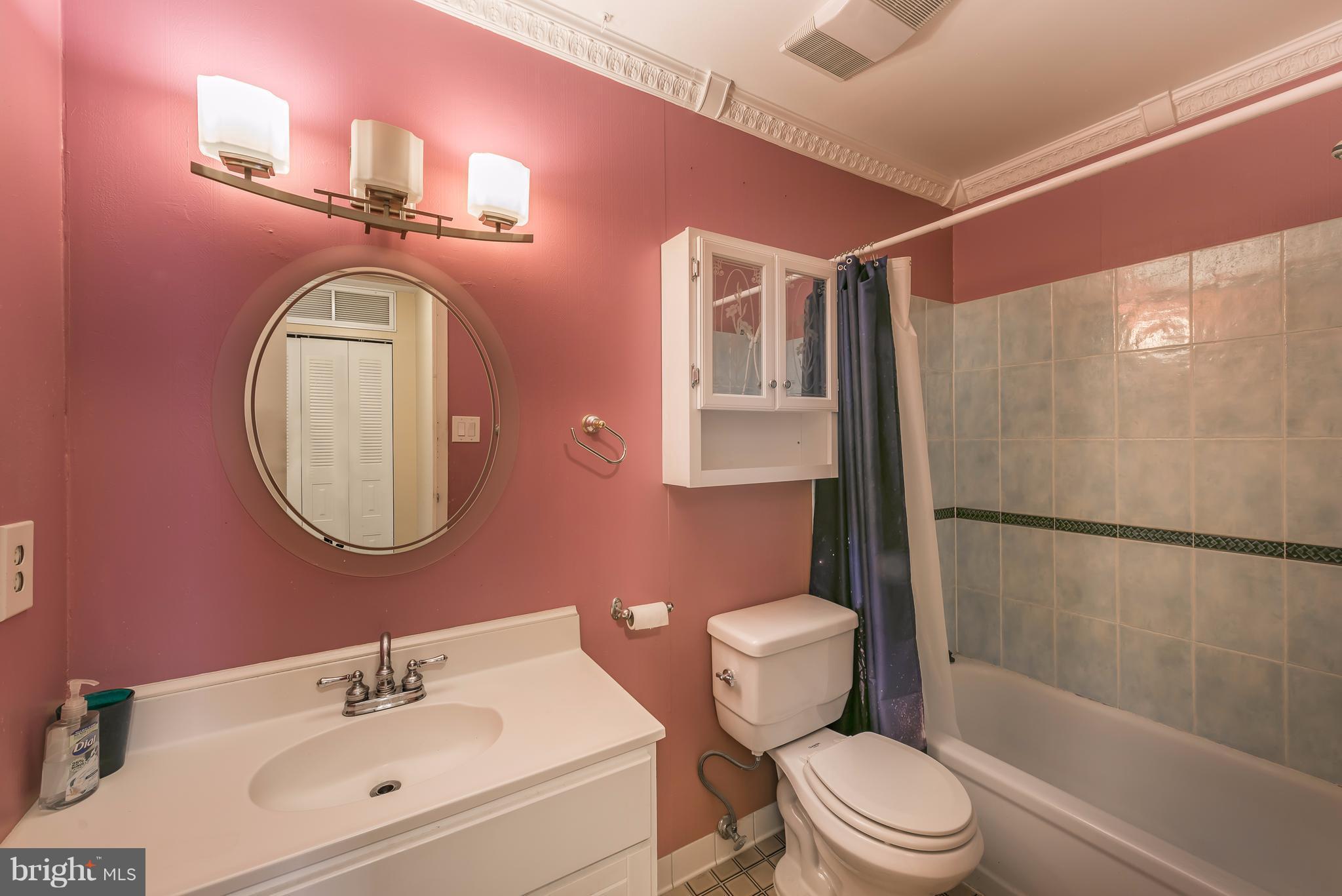 6137 Edsall Road, Unit O Alexandria, VA 22304 - Photo 11 of 13 a bathroom with a sink toilet and shower