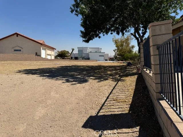 a view of car parked on road with building in background