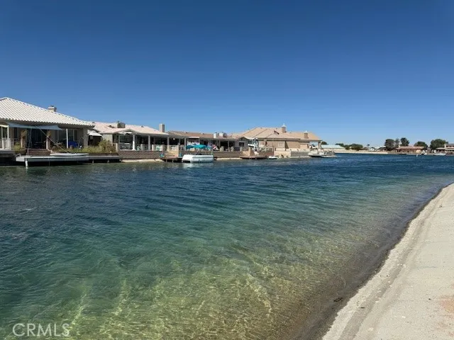a view of a lake with big yard