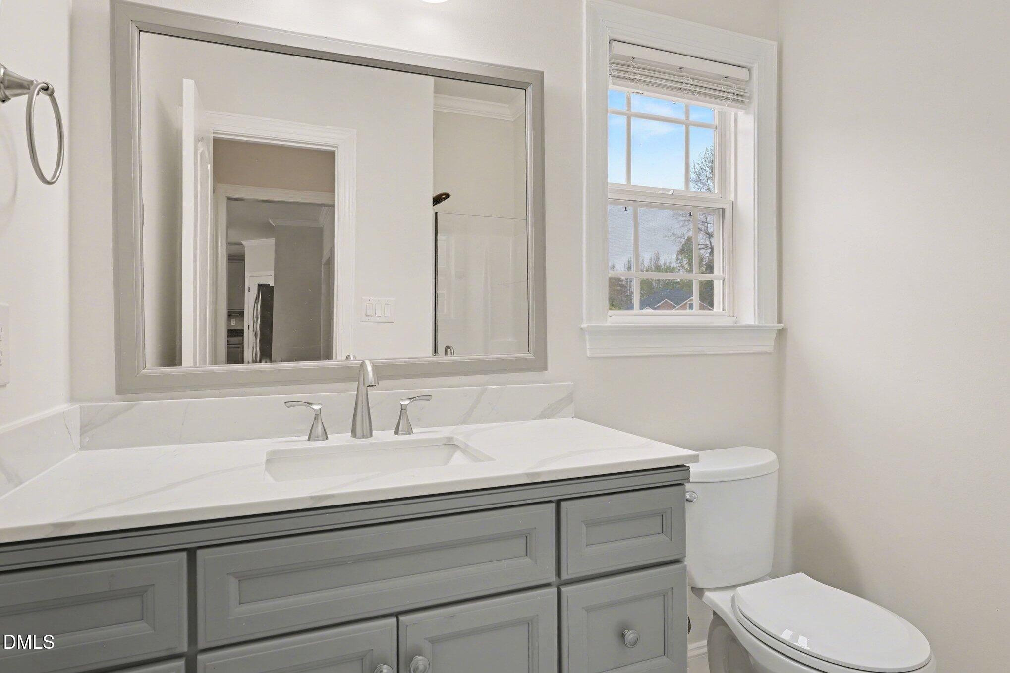 7250 Sandcastle Lane Linden, NC 28356 - Photo 13 of 20 a bathroom with a sink toilet and vanity