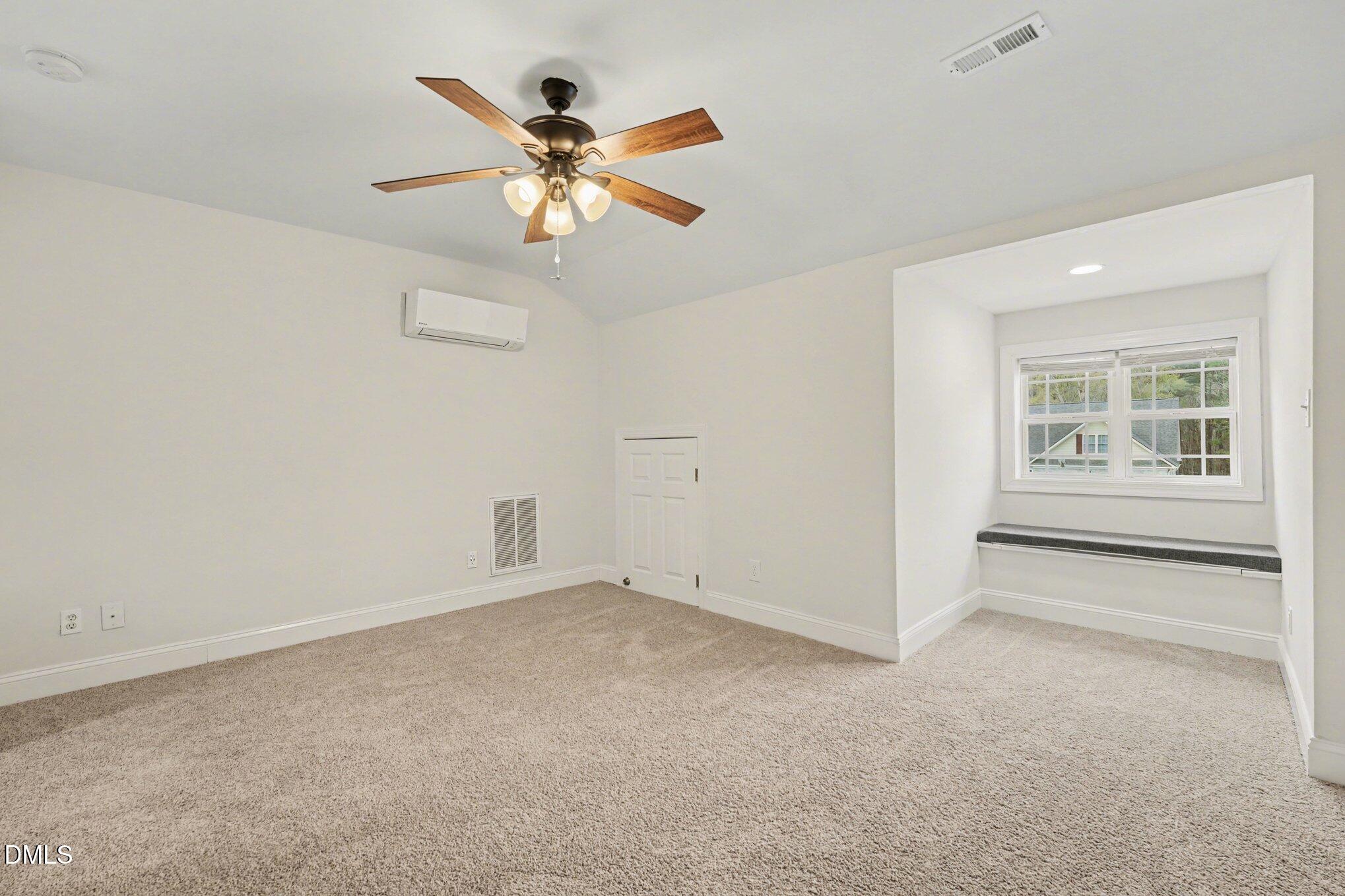 7250 Sandcastle Lane Linden, NC 28356 - Photo 17 of 20 an empty room with windows and fan