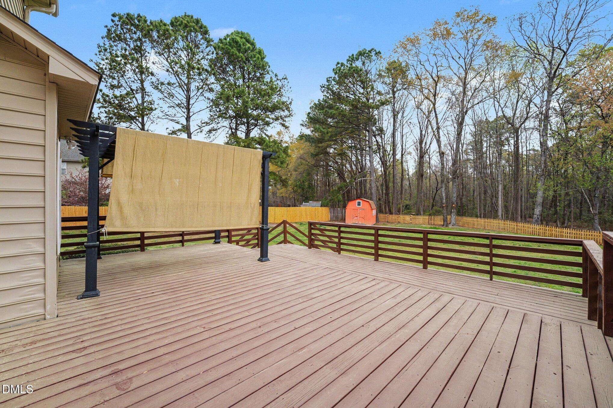7250 Sandcastle Lane Linden, NC 28356 - Photo 19 of 20 a backyard of a house with wooden floor and fence