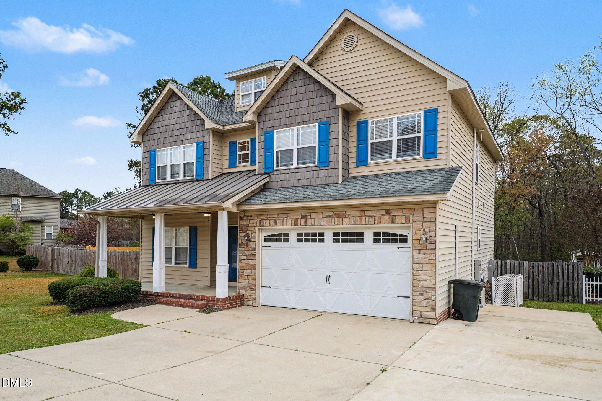 7250 Sandcastle Lane Linden, NC 28356 - Photo 2 of 20 a front view of a house with a yard
