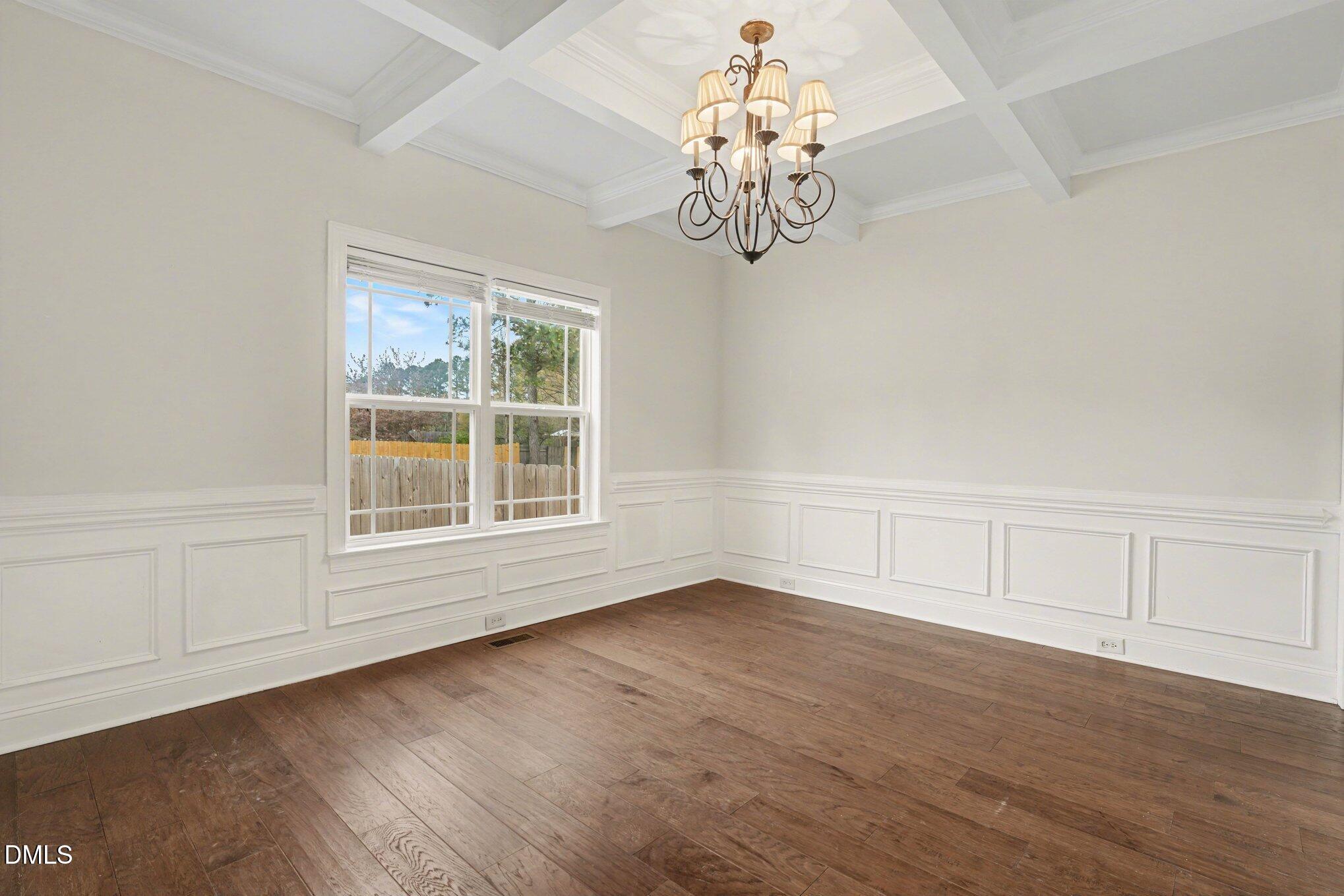 7250 Sandcastle Lane Linden, NC 28356 - Photo 7 of 20 a view of an empty room with wooden floor and a window